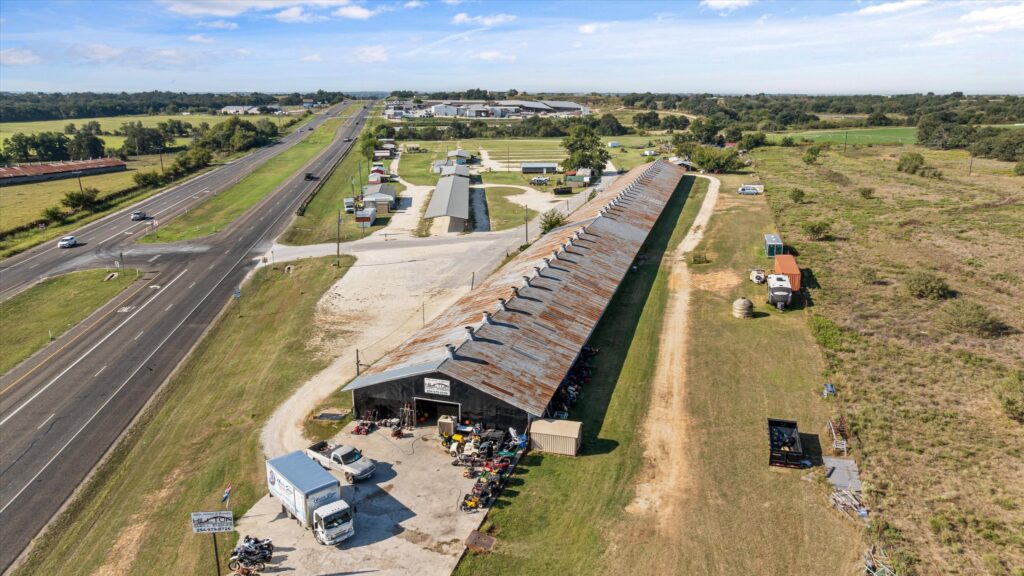 Commercial property for sale at 8080 S US Highway 377 in Dublin, Texas. The listing includes 13.99 acres with 32,500 square feet of building space currently used for a flea market, café, antiques, and repair shop. Listed at $4,000,000 by Preferred Properties of Texas, serving Stephenville, Dublin, and the Cross Timbers area.